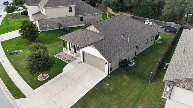 135 Pine Island Ln, Leander, TX 78641 - kitchen featuring appliances with stainless steel finishes, a sink, light stone countertops, decorative backsplash, and a chandelier