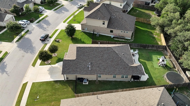135 Pine Island Ln, Leander, TX 78641 - kitchen with appliances with stainless steel finishes, a sink, a peninsula, tasteful backsplash, and light stone counters