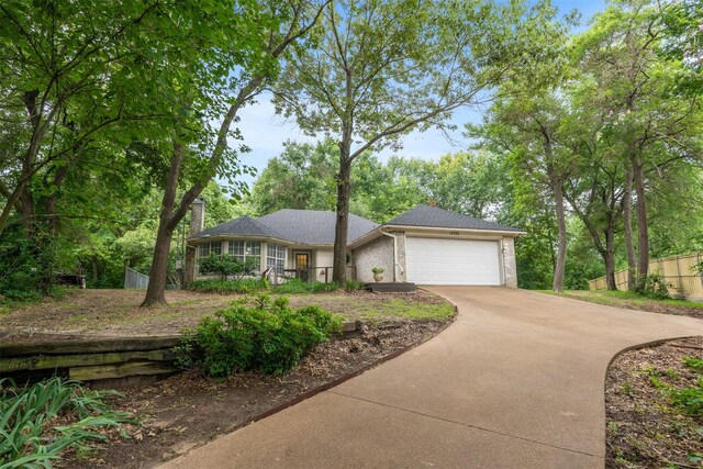12752 Honeysuckle Cir, Eustace, TX 75124 - ranch-style house with concrete driveway, an attached garage, and brick siding