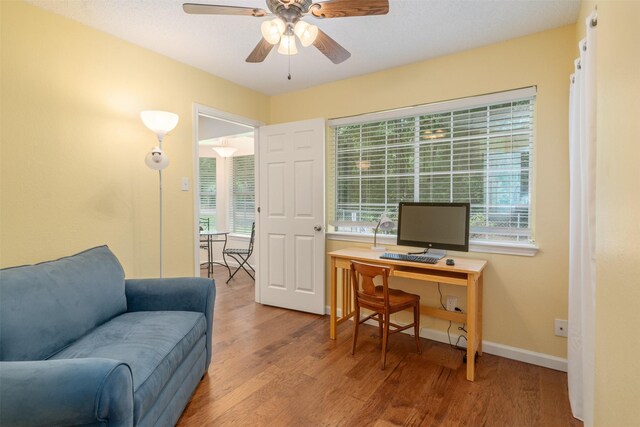 12752 Honeysuckle Cir, Eustace, TX 75124 - office with wood finished floors, a ceiling fan, and plenty of natural light