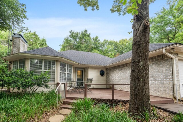 12752 Honeysuckle Cir, Eustace, TX 75124 - ranch-style home with a wooden deck, a chimney, roof with shingles, and brick siding