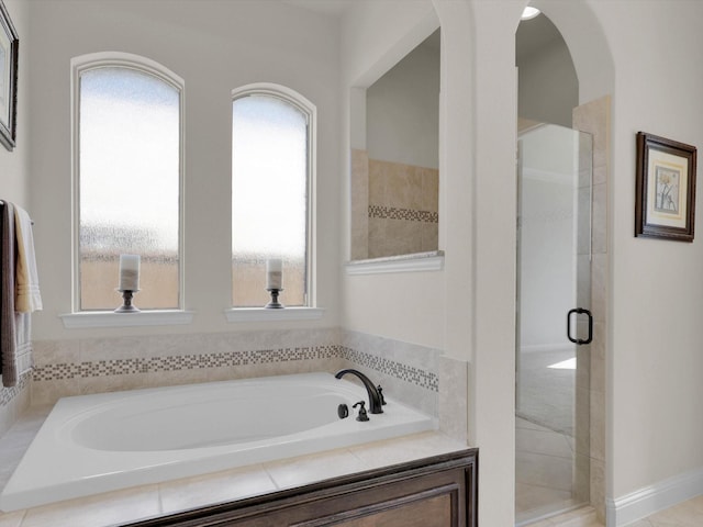 14875 Story Ln, Frisco, TX 75035 - bathroom with plenty of natural light, a bath, and a stall shower