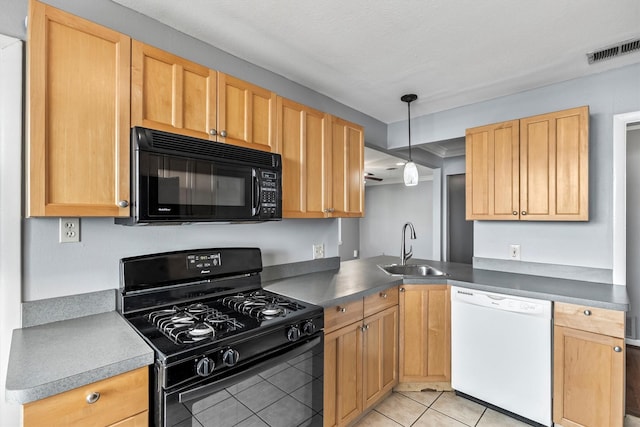 2969 Eric Ln, Farmers Branch, TX 75234 - kitchen featuring black appliances, light tile patterned flooring, pendant lighting, dark countertops, and light brown cabinetry