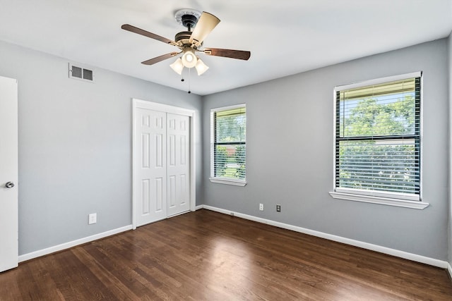 2969 Eric Ln, Farmers Branch, TX 75234 - unfurnished bedroom with wood finished floors, a closet, and ceiling fan