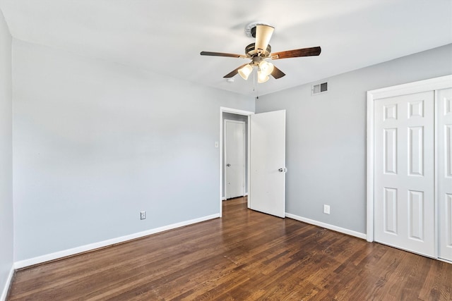2969 Eric Ln, Farmers Branch, TX 75234 - unfurnished bedroom with dark wood-type flooring, a closet, and ceiling fan