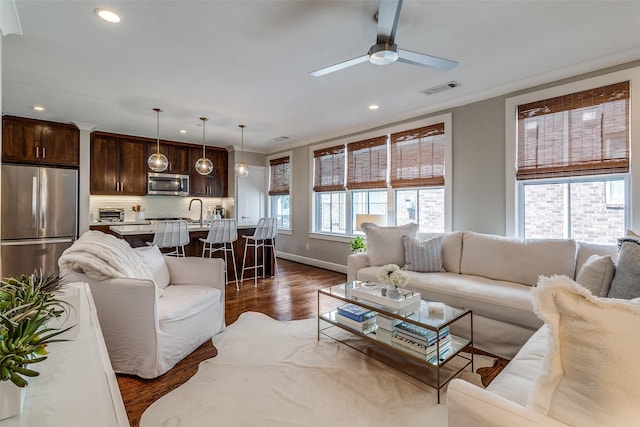 4121 Grassmere Ln Unit 3, University Park, TX 75205 - living area featuring recessed lighting, dark wood finished floors, a ceiling fan, baseboards, and crown molding