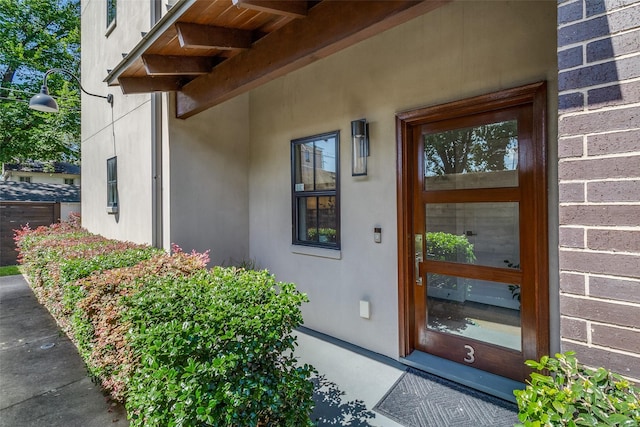 4121 Grassmere Ln Unit 3, University Park, TX 75205 - view of exterior entry featuring stucco siding