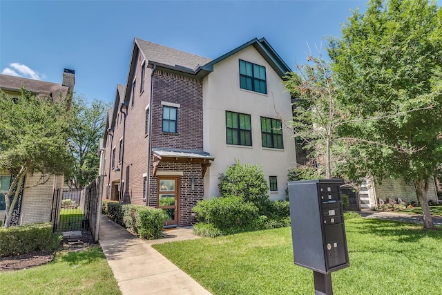 4121 Grassmere Ln Unit 3, University Park, TX 75205 - view of front of property with brick siding, a front lawn, and stucco siding