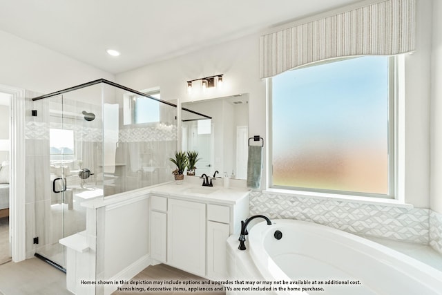 411 Atlas Cedar Dr, Glenn Heights, TX 75154 - full bath with healthy amount of natural light, a bath, vanity, and a stall shower