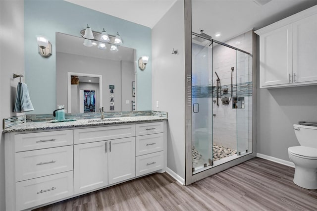 1016 Crestview Dr, Sherman, TX 75092 - full bathroom featuring wood finished floors, vanity, and a shower stall