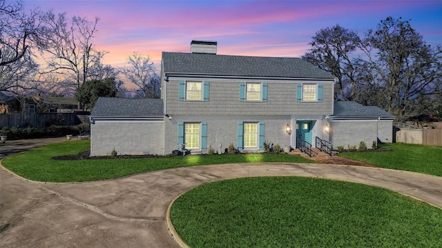 1016 Crestview Dr, Sherman, TX 75092 - view of front of property featuring curved driveway, a chimney, roof with shingles, and entry steps