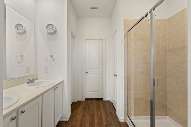 797 Hawthorn St, Princeton, TX 75407 - full bath featuring a shower stall, double vanity, and wood finished floors
