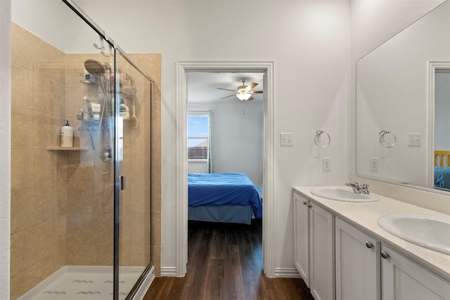 797 Hawthorn St, Princeton, TX 75407 - bathroom featuring ensuite bathroom, a shower stall, double vanity, wood finished floors, and a ceiling fan