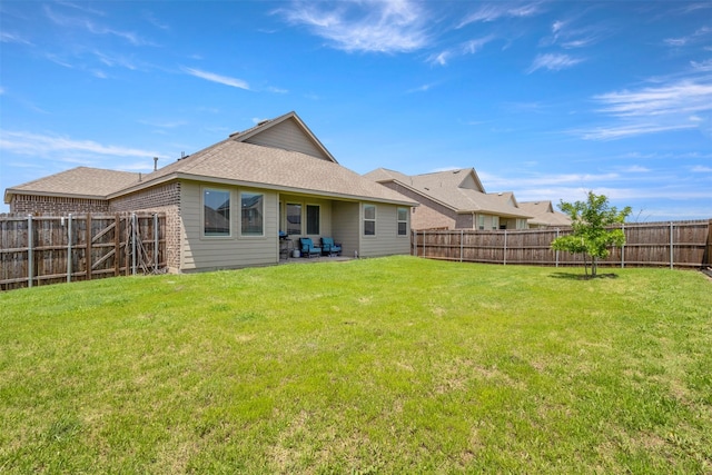 797 Hawthorn St, Princeton, TX 75407 - rear view of house featuring a fenced backyard, a patio, and roof with shingles