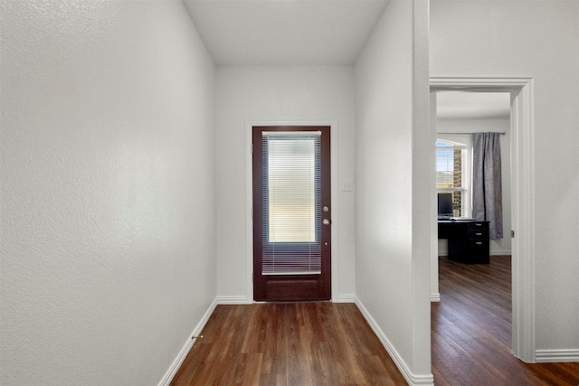 797 Hawthorn St, Princeton, TX 75407 - doorway to outside with dark wood-style floors and baseboards