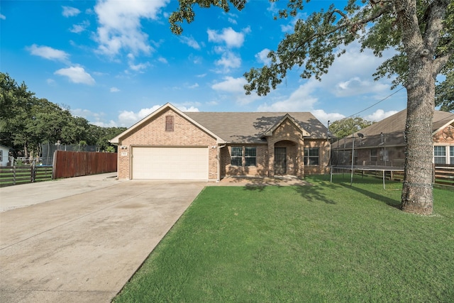 5414 Wild Oak Rd, Balch Springs, TX 75180 - view of front of property featuring a trampoline, brick siding, concrete driveway, a garage, and a shingled roof