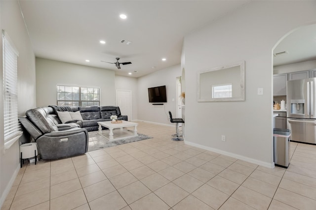 5414 Wild Oak Rd, Balch Springs, TX 75180 - living room featuring ceiling fan, recessed lighting, arched walkways, light tile patterned floors, and baseboards