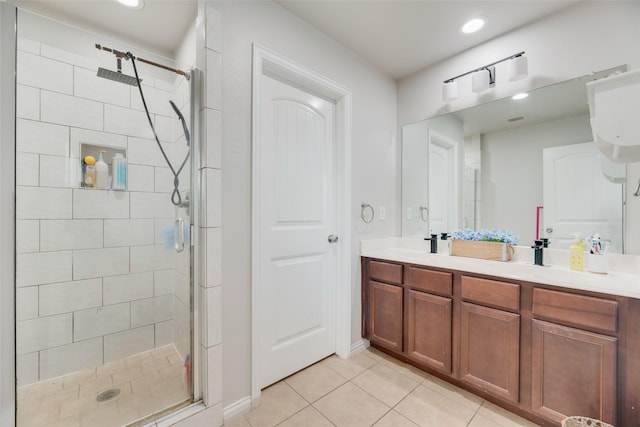5414 Wild Oak Rd, Balch Springs, TX 75180 - full bath featuring a shower stall, tile patterned flooring, double vanity, recessed lighting, and baseboards