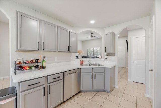 5414 Wild Oak Rd, Balch Springs, TX 75180 - kitchen featuring stainless steel dishwasher, gray cabinets, a sink, light tile patterned floors, and recessed lighting