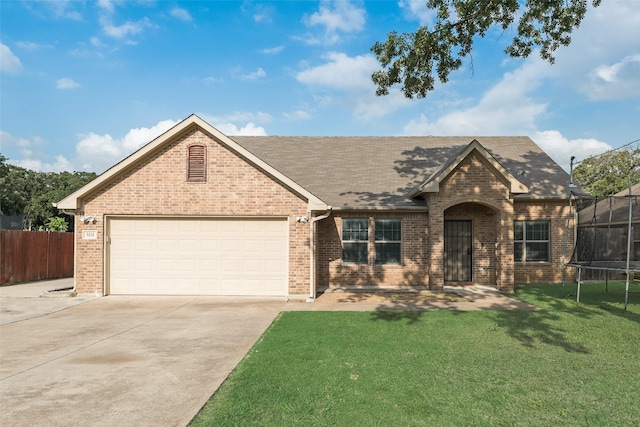 5414 Wild Oak Rd, Balch Springs, TX 75180 - view of front of house featuring a trampoline, brick siding, concrete driveway, a garage, and a shingled roof