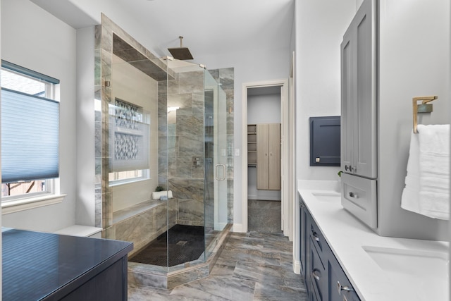 1208 Claire St, Lantana, TX 76226 - full bathroom featuring marble tiled floors, double vanity, a stall shower, and healthy amount of natural light