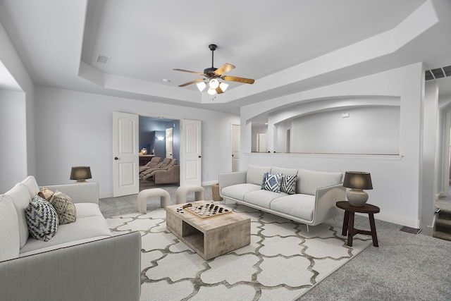 1208 Claire St, Lantana, TX 76226 - carpeted living area featuring a raised ceiling and a ceiling fan