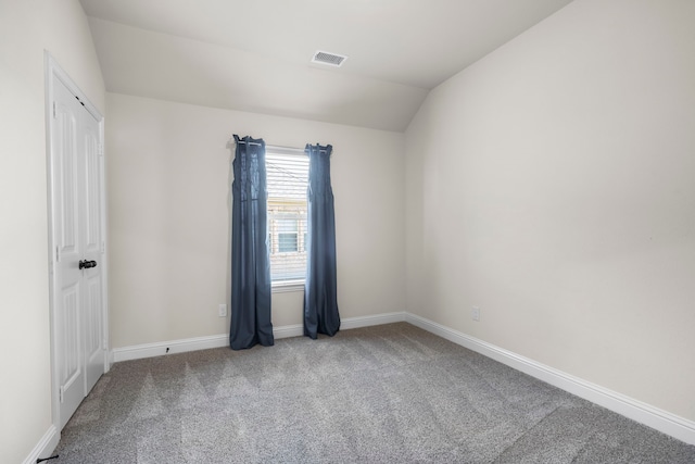 1208 Claire St, Lantana, TX 76226 - spare room featuring carpet flooring and vaulted ceiling
