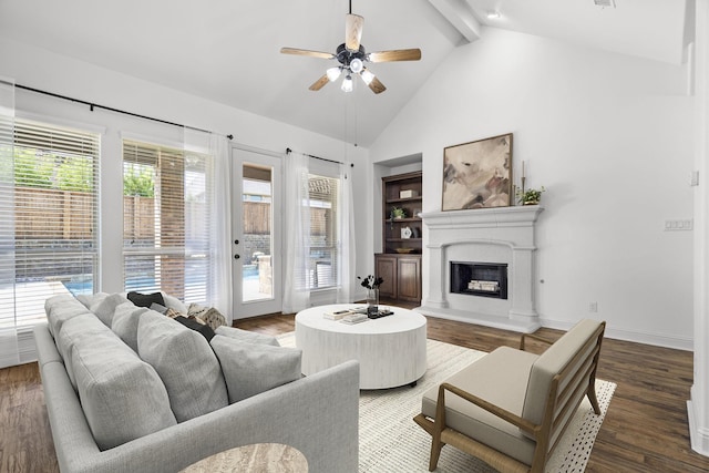 1208 Claire St, Lantana, TX 76226 - living room with ceiling fan, beam ceiling, a fireplace with raised hearth, wood finished floors, and high vaulted ceiling