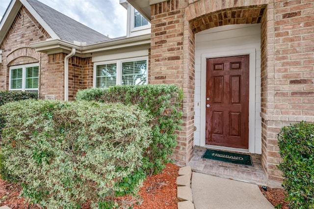 5839 Twilight Dr, Grand Prairie, TX 75052 - doorway to property with brick siding and roof with shingles