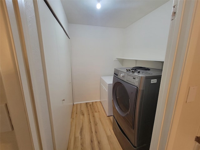 1340 Finley Dr, Plano, TX 75025 - washroom featuring washer and clothes dryer and light wood-style floors