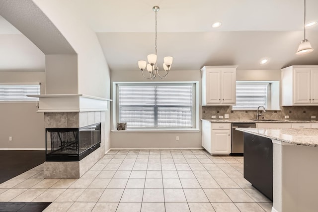 2124 Leonard Ranch Rd, Fort Worth, TX 76134 - kitchen featuring dishwasher, a sink, white cabinets, pendant lighting, and tasteful backsplash