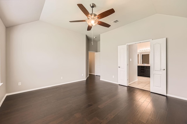 2124 Leonard Ranch Rd, Fort Worth, TX 76134 - unfurnished bedroom with lofted ceiling, wood finished floors, baseboards, a ceiling fan, and connected bathroom