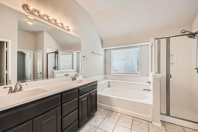 2124 Leonard Ranch Rd, Fort Worth, TX 76134 - full bath with lofted ceiling, a shower stall, a bath, tile patterned floors, and double vanity
