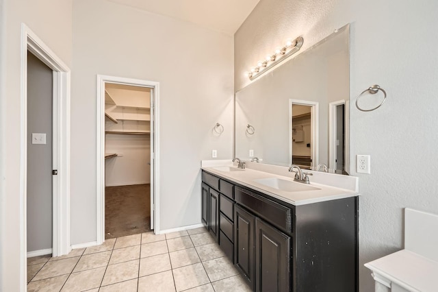 2124 Leonard Ranch Rd, Fort Worth, TX 76134 - bathroom with double vanity, tile patterned floors, and a spacious closet