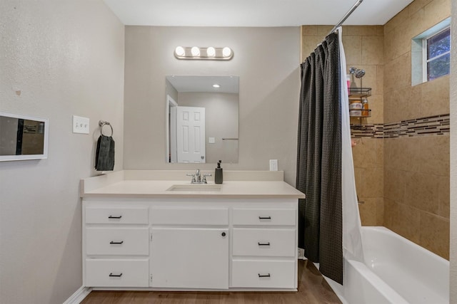 203 Olive St, Waxahachie, TX 75165 - full bath with vanity, shower / bathtub combination with curtain, and wood finished floors