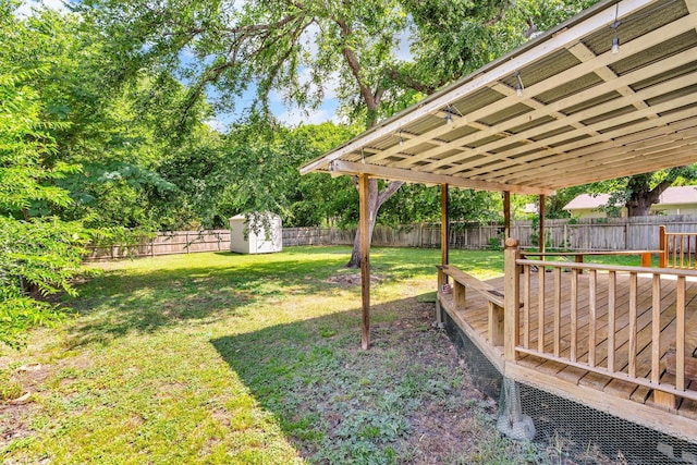 203 Olive St, Waxahachie, TX 75165 - fenced backyard with a shed and a deck