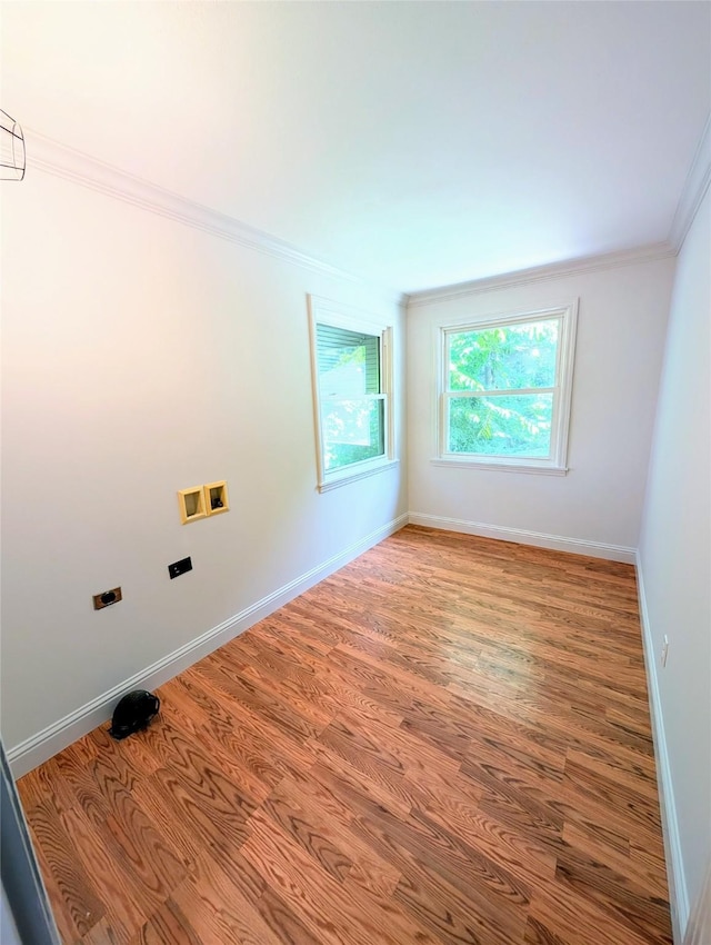 922 Ratcliff St, Shreveport, LA 71104 - empty room featuring ornamental molding, wood finished floors, and baseboards