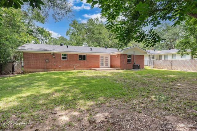 2869 Alkay Dr, Shreveport, LA 71118 - back of house featuring french doors, brick siding, central AC, and a patio area
