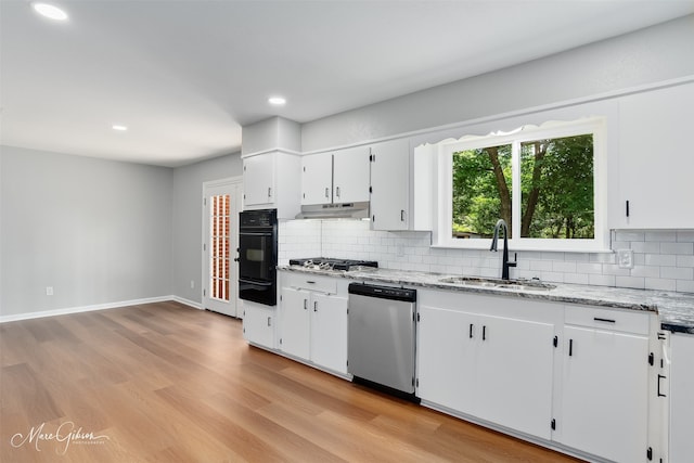2869 Alkay Dr, Shreveport, LA 71118 - kitchen featuring a sink, appliances with stainless steel finishes, tasteful backsplash, recessed lighting, and light stone countertops