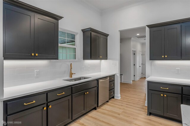 231 Ramsey, Stonewall, LA 71078 - kitchen with dishwasher, crown molding, decorative backsplash, light wood-style flooring, and light countertops