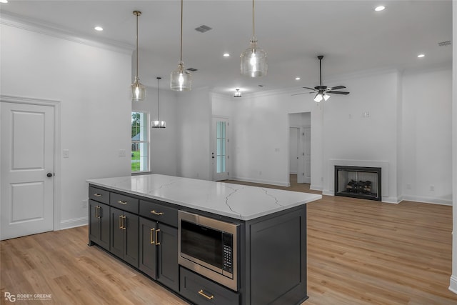 231 Ramsey, Stonewall, LA 71078 - kitchen with stainless steel microwave, ornamental molding, light wood finished floors, ceiling fan, and recessed lighting