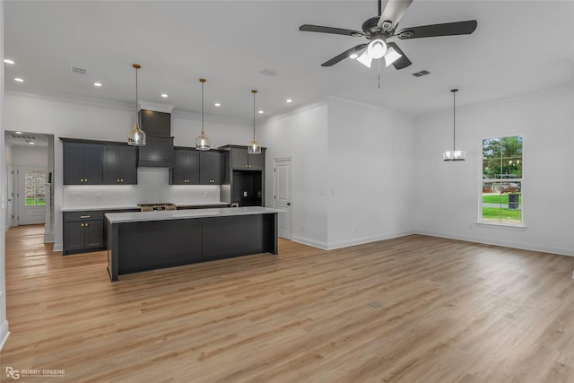 231 Ramsey, Stonewall, LA 71078 - kitchen featuring healthy amount of natural light, a ceiling fan, crown molding, light wood-style flooring, and wall chimney range hood