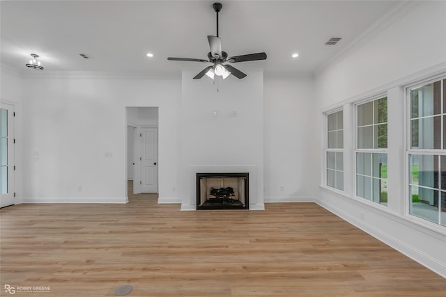 231 Ramsey, Stonewall, LA 71078 - unfurnished living room featuring crown molding, light wood finished floors, healthy amount of natural light, a ceiling fan, and recessed lighting