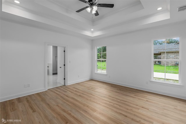 231 Ramsey, Stonewall, LA 71078 - spare room with a tray ceiling, ornamental molding, plenty of natural light, light wood-style floors, and recessed lighting