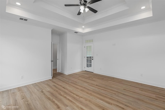 231 Ramsey, Stonewall, LA 71078 - empty room with a tray ceiling, light wood finished floors, ornamental molding, a ceiling fan, and recessed lighting