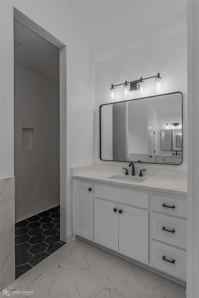 231 Ramsey, Stonewall, LA 71078 - bathroom with vanity, marble look tiles, and tiled shower
