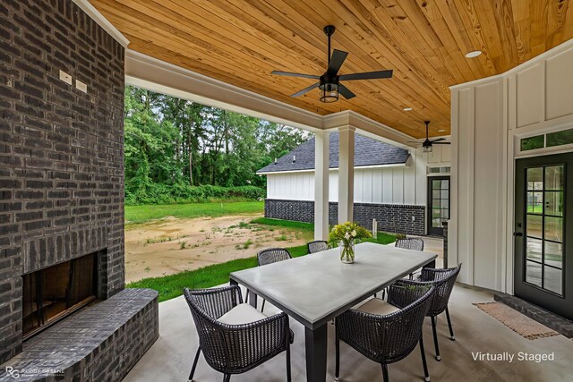 231 Ramsey, Stonewall, LA 71078 - view of patio featuring an outdoor brick fireplace, a ceiling fan, and outdoor dining space