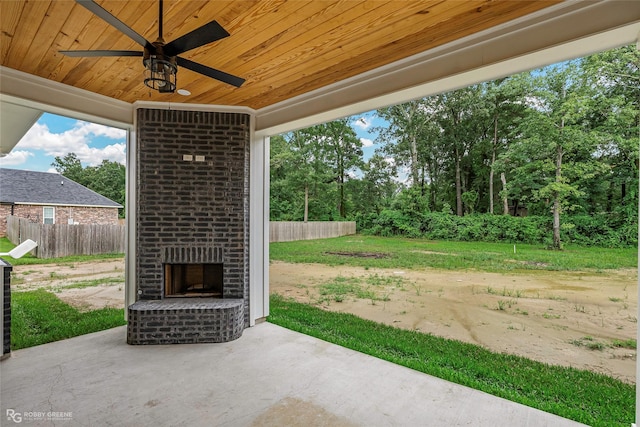 231 Ramsey, Stonewall, LA 71078 - view of patio / terrace with an outdoor brick fireplace and a ceiling fan