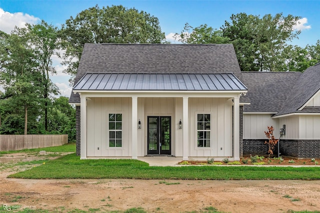 231 Ramsey, Stonewall, LA 71078 - view of front of property featuring french doors, a shingled roof, board and batten siding, and a standing seam roof
