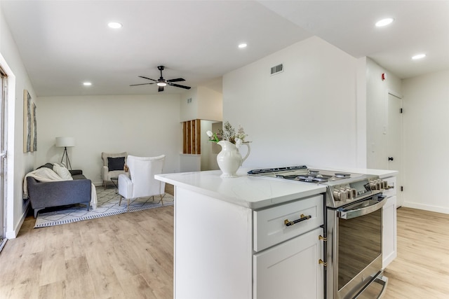 806 Brookshire Cir, Garland, TX 75043 - kitchen with stainless steel stove, light wood-type flooring, recessed lighting, a center island, and open floor plan